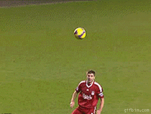 soccer player missing ball and falling down